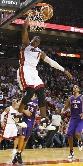 Dwyane Wade Dunking On Someone Wallpaper Dunk