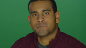 Young African American Man Looking Intimidating On A Green