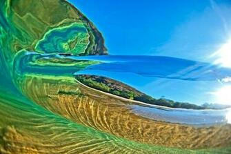 Shot Underwater And From Behind A Breaking Wave Beach On The Island