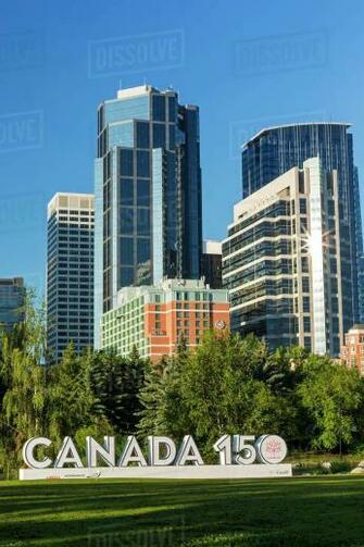 Canada Signage In City Park With Calgary Building Towers