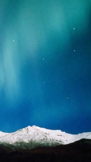 Aurora Borealis iPhone Wallpaper Over Peaks