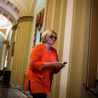 Claire Mccaskill Walking Through Capitol Hill Wallpaper
