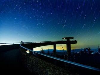 National Park With The Lights Of Gatlinburg Glowing In Distance