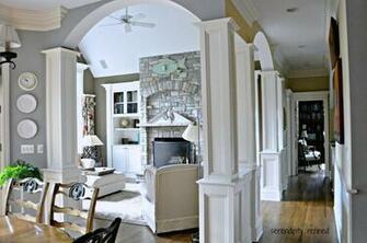 Great Room Fireplace Stone Columns Built In Arches White Furniture