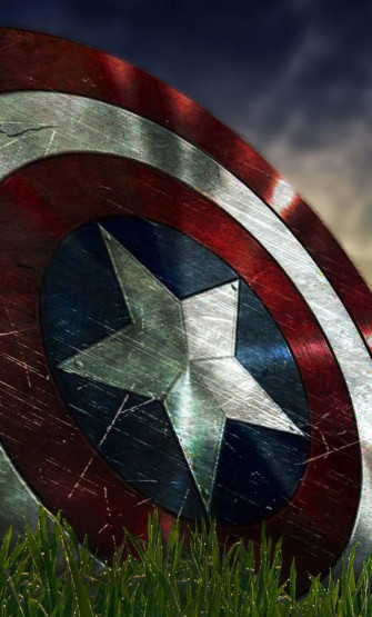 Captain America Shield iPhone On Grass Wallpaper