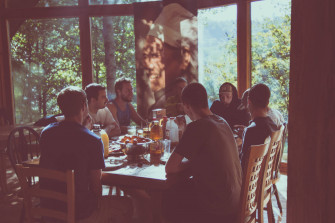 Group Of People Eating Together Wallpaper