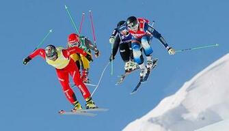 Skiers Compete During The Skicross Event Of Fis