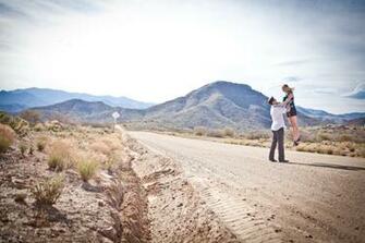 In Arizona Desert With Sprawling Mountains Background Onewed