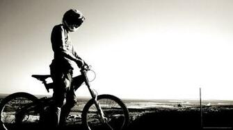 Guy In Helmet On A Mountain Bike Wallpaper