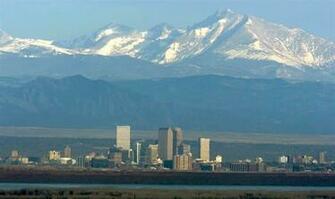 Denver Skyline With The Front Range Peaks Of Rocky Mountains