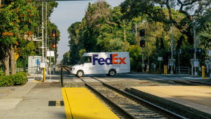 Fedex Van At Railway Crossing 5ntnp0exu8e56k19 Wallpaper