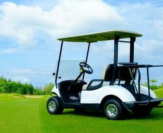 Golf Cart On Green Lawn With Blue Sky And Cloud For Background