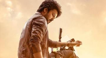 Varisu Third Look Vijay Strikes Stylish Pose On A Fancy Bike