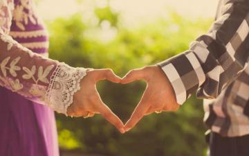 Girl And Boy Couple Making Heart By Hand Love