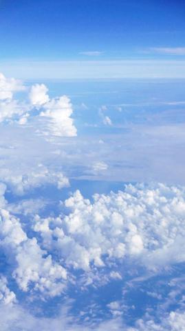 Vertical Light Blue Sky And Clouds Wallpaper