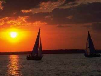 Sunset By Sailboats Wallpaper