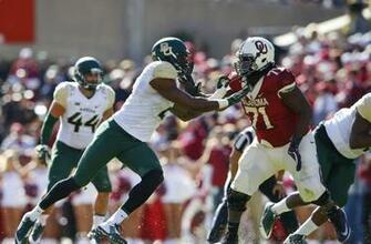 Shawn Oakman Rushes Against Oklahoma Sooners Offensive Tackle Tyrus