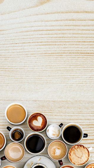 Coffee Mugs On A Light Beige Wooden Textured Background