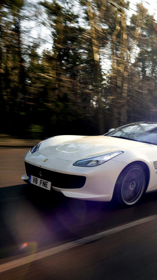 Add A Bit Of Luxury To Your Life With White Ferrari iPhone Wallpaper