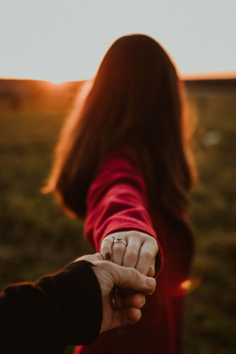 A Couple Holding Hands Wallpaper