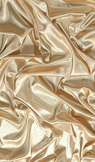 Rich Golden Silk Fabric Shining In The Light Wallpaper