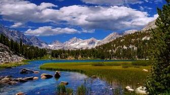 Beautiful Landscape Scenery River Grass Mountains And
