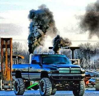 Black Second Gen Dodge Cummins Diesel Roll Coal Lifted