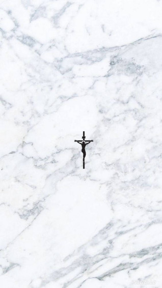 Adorable Young Girl Sporting A Trendy Cross Necklace Wallpaper