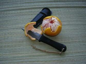 Cutting An Orange Easily Alongside Pentagon Elite Wallpaper