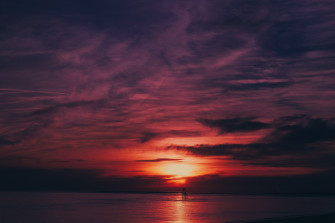 Sky Sea Flares Sunset Water Reflection 4k Wallpaper HD Nature