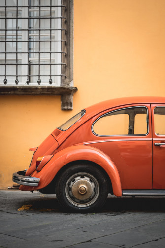 Shallow Focus Photo Of Orange Volkswagen Beetle