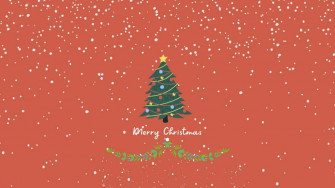 A Christmas Tree With Snow Falling On It Wallpaper