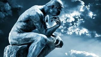 Stone Statue Of The Thinker With Clouds In Background