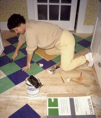 Them In Place Lisa Jordan Smooths Seams With A Wallpaper Seam Roller