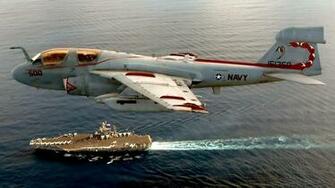 A6 Intruder Over Aircraft Carrier Wallpaper