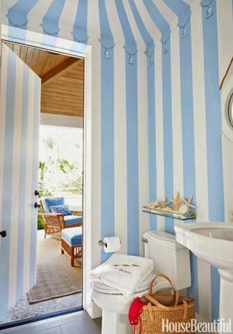 Powder Room Near The Pool Is Painted To Look Like A Cabana With