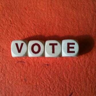 Vote Spelled Out On A Red Background