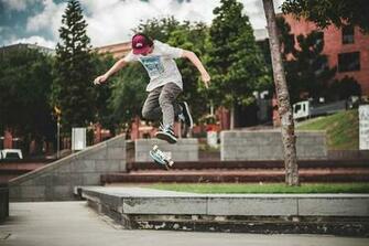 HD Wallpaper Kickflip Man Riding Skateboard Doing Stunt During