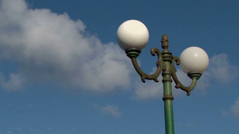 White Clouds Rush Over An Old Lamppost On Santorini Greece Stock