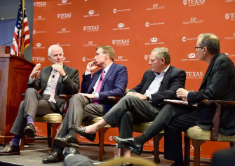 John Cornyn On A Stage With Peers Wallpaper