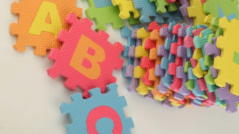 A Colorful Puzzle With Letters And Numbers Wallpaper