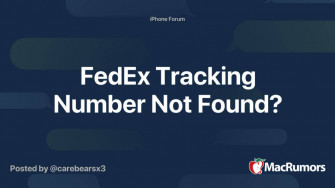 A Fedex Employee Scanning Package With Barcode Scanner Wallpaper