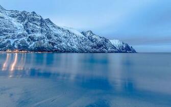 Lights Reflecting In The Frozen Mountain Lake Wallpaper