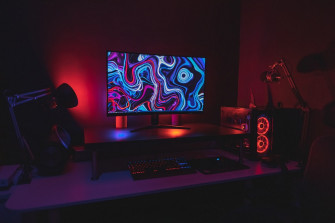 Black Flat Screen Computer Monitor Turned On Near