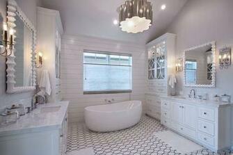 White And Gray Bathroom Features A Shiplap Clad Accent Wall Lined With