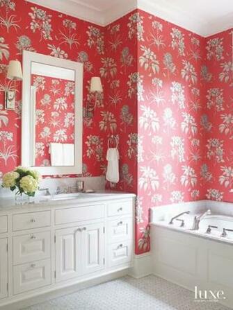 Vibrant Red Floral Wallpaper With Mirror And Soaking Tub Luxe