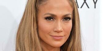 Jennifer Lopez Shows A Lot Of Leg In Donna Karan Dress At The