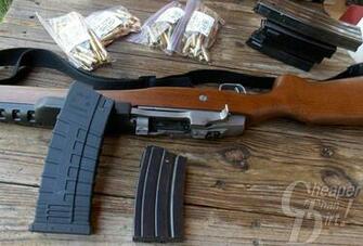 Brown Ruger Mini Lying On A Wooden Background