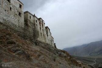 Buddhist Monk On Top Of A Monastery Tibetan Wallpaper