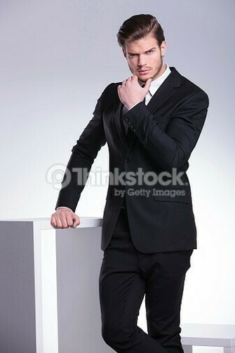 Stock Photo Handsome Young Business Man Leaning On A White Table
